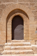 Fototapeta na wymiar Iron entrance gate to medieval castle keep in Lorca city, Murcia, Spain