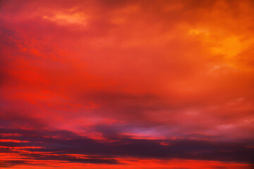 Sky sunset in the evening with colorful orange sunlight. Beautiful majestic nature background
