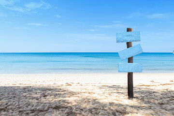 Wooden blank sign on the beach, summer concept background, outdoor day light