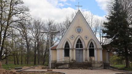 Fototapeta na wymiar catholic tom building with cross