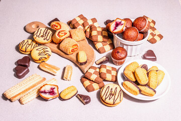 Assorted various cookies and muffins