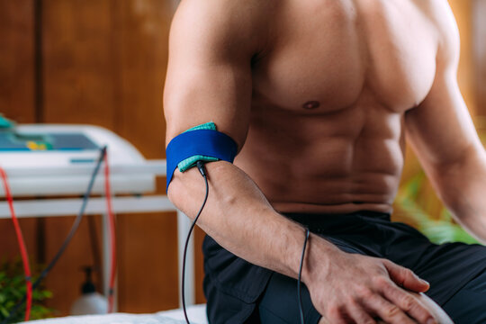 Elbow Physical Therapy with TENS Electrode Brace Pads, Transcutaneous Electrical Nerve Stimulation