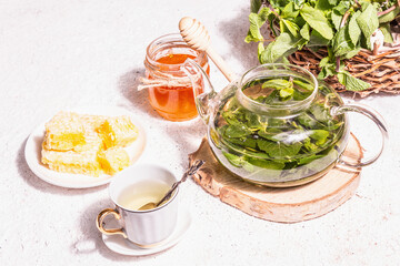 Teatime concept with aromatic mint tea, sweet honey