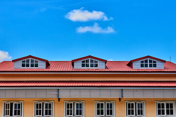 fluffy clouds with blue sky over the roof top building 