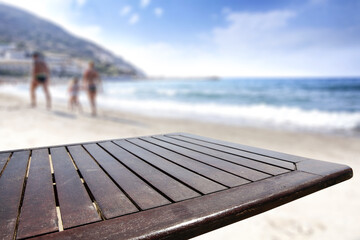 Fototapeta na wymiar Wooden desk of free space and summer beach landscape 