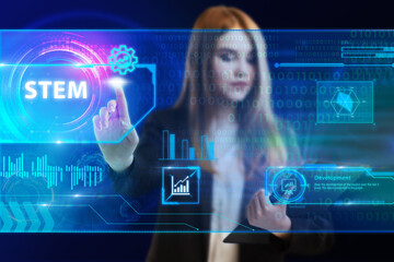 Business, Technology, Internet and network concept. Young businessman working on a virtual screen of the future and sees the inscription: STEM