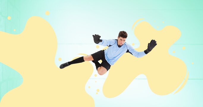 Composition of football goalkeeper over yellow splodges and blue background