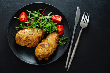 Grilled chicken breast with vegetables and salad