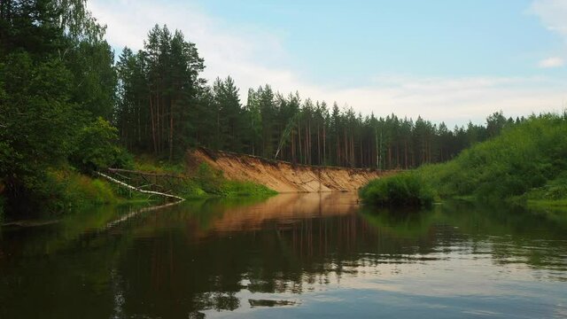 Beautiful landscape view on the high bank of the forest river. Silence in unique natural locations far from civilisation. Vacation on the forest river. Maliy Kundish river, Mari El republic, Russia