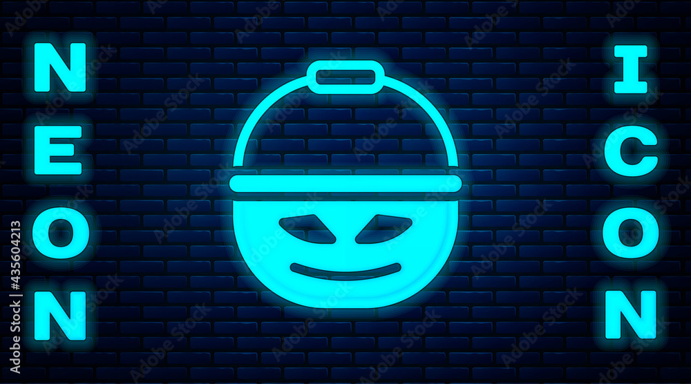 Wall mural Glowing neon Pumpkin basket for sweets icon isolated on brick wall background. Happy Halloween party. Vector