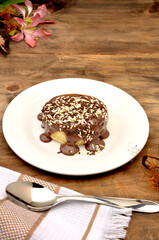 round cake with chocolate icing and sprinkles