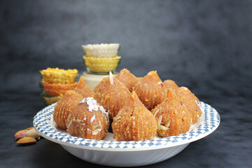 Besan ke ladoo or Motichur ke ladoo or Modak made from Chickpea flour,desi ghee and sugar during festival season like Diwali nad Ganesh chaturthi.