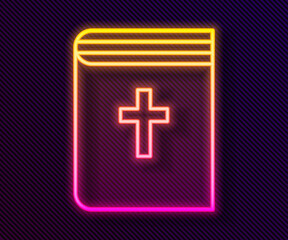 Glowing neon line Holy bible book icon isolated on black background. Vector