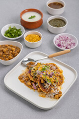 Aloo Tikki or Cutlet or Aloo Patties  dipped in Chickpea curry