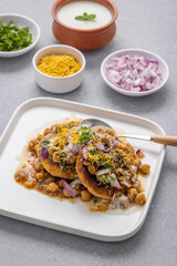Aloo Tikki or Cutlet or Aloo Patties  dipped in Chickpea curry