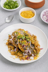 Aloo Tikki or Cutlet or Aloo Patties  dipped in Chickpea curry