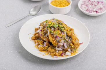 Aloo Tikki or Cutlet or Aloo Patties  dipped in Chickpea curry
