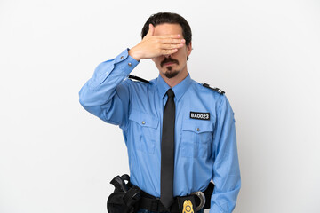 Young police man over isolated background white covering eyes by hands. Do not want to see something