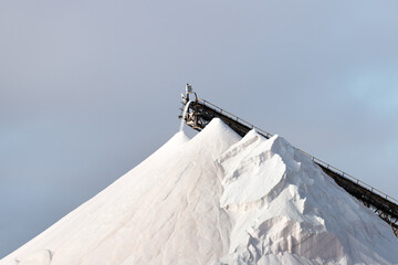Huge pile of salt against the blue sky