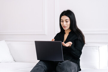 Female freelancer having online meeting at home