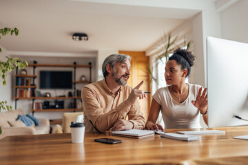 African woman, helping her partner to understand something.