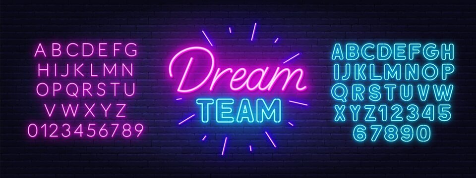 Dream Team neon sign on brick wall background.