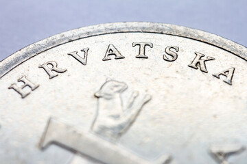 A fragment of croatian metal coin macro photo