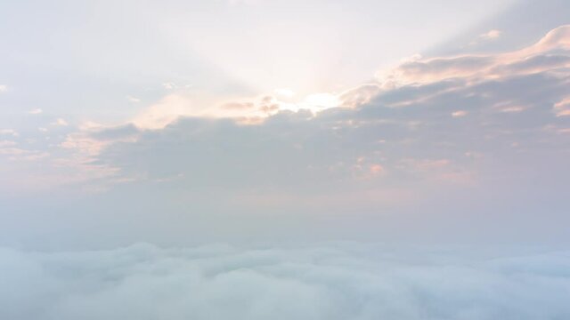 Timelapse clouds moving fast in during sunrise. view of fog flowing from the top of a mountain, Khao Phra Ya Dern Thong View Point Lopburi Thailand