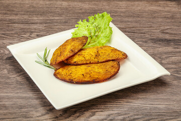 Baked potato with herbs and spices