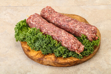 Raw minced beef kebab skewer