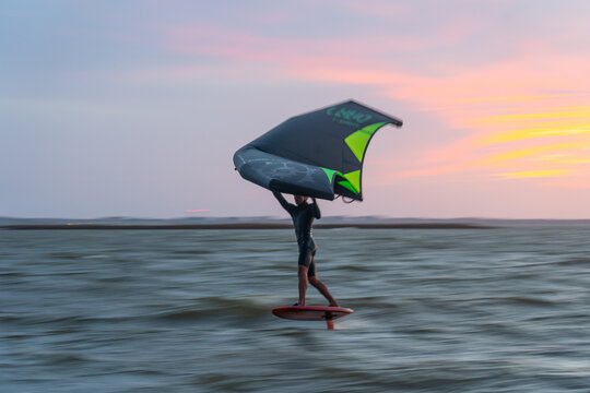 Pro surfer James Jenkins on his wing surfer flies across the Pamlico Sound at Nags Head, North Carolina