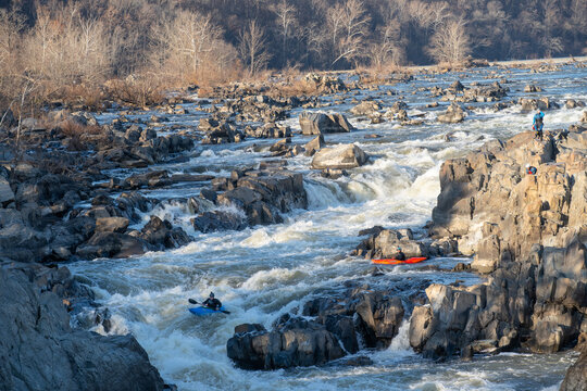 Kayakers thread their way down a series of challenging drops that make up Great Falls of the Potomac River, Virginia