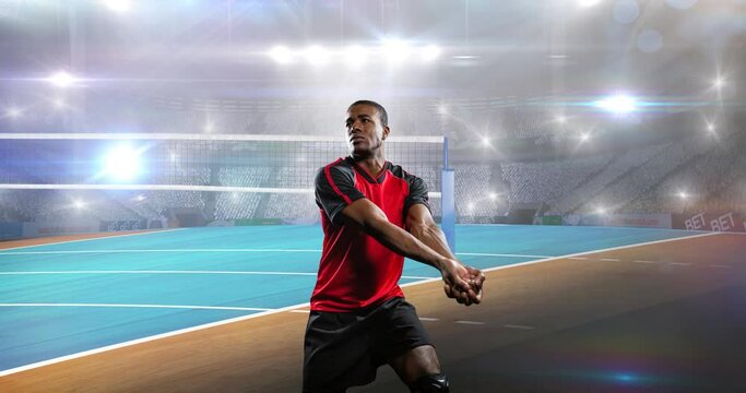 Animation of male netball player over sports stadium and spotlights