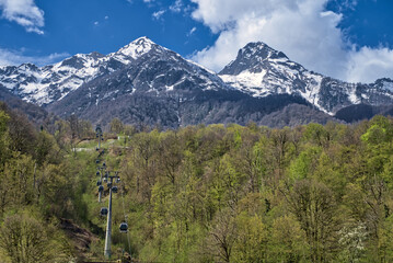 Mountain landscape, cable car. Ski resort. Sports vacation.