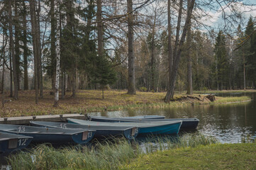 Blue boats on the river bank in Gatchina park