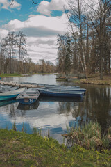 Blue boats on the river bank in Gatchina park