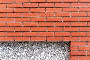 Orange brick wall with a copy space in the bottom of the frame 
