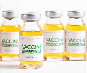 Looped. Flasks of vaccine for COVID-19 coronavirus in research lab. Vaccination, injection, clinical trial during pandemic, macro