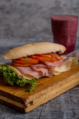 ham, cheese and lettuce sandwich with smoothie