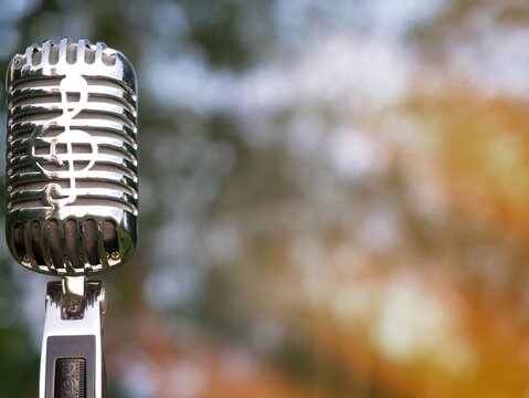 Microphone image used for advertisement. Background is bokeh.