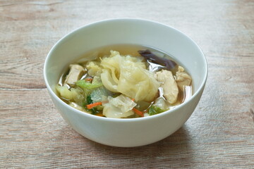 boiled cabbage and mixed vegetable with chicken soup on bowl
