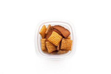 School lunch box snack for kids over white background. Back to school. Healthy and fun snack option for parents. Bow with crackers.