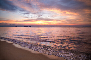 Fototapeta na wymiar Beautiful sea view landscape with dramatic sunset cloud sky.