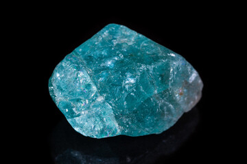 Macro mineral stone apatite on black background