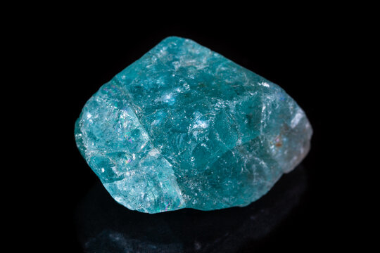 Macro mineral stone apatite on black background