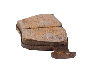 Old worn out and worn out brake pad on a white background, close-up, isolate. Concept of...