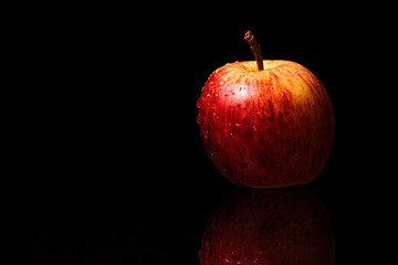 Red apple on a black background