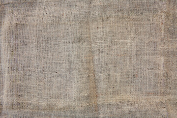 Fototapeta premium Texture of sack. Burlap background. Natural linen texture for background. Jute hessian sackcloth canvas sack cloth woven texture pattern in beige, gray, brown color. Copy space.