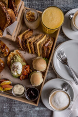 full breakfast with coffee, toast, croissants ready to eat