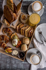 full breakfast with coffee, toast, croissants ready to eat